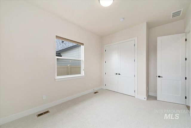 6356 S Cubola Way, Meridian, ID 83642 - unfurnished bedroom with light carpet, baseboards, and a closet