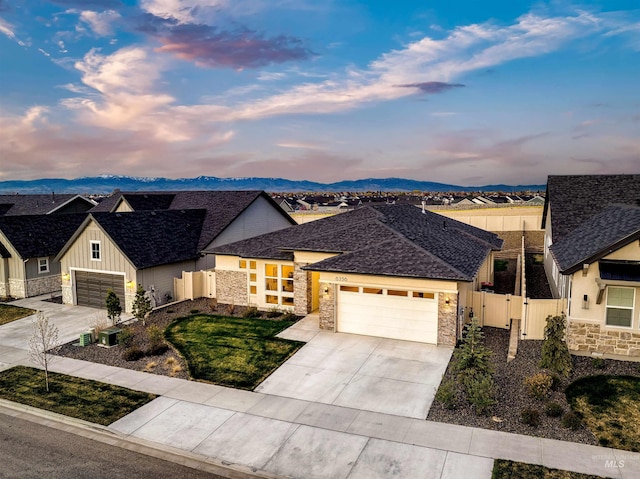 6356 S Cubola Way, Meridian, ID 83642 - view of front of home featuring stone siding, concrete driveway, and an attached garage