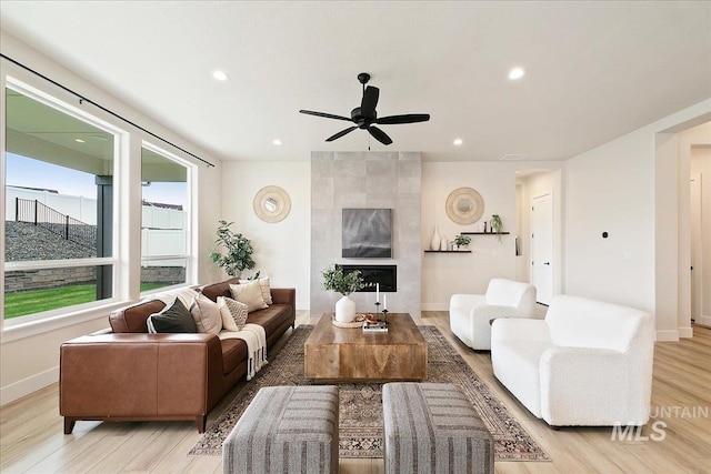 6356 S Cubola Way, Meridian, ID 83642 - living room featuring light wood finished floors, ceiling fan, baseboards, recessed lighting, and a tiled fireplace