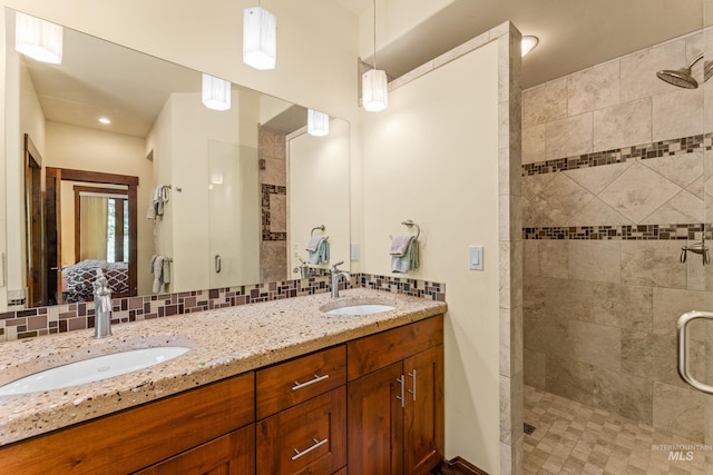 278 Elk Lake Rd, New Meadows, ID 83654 - full bathroom featuring a stall shower, double vanity, and backsplash