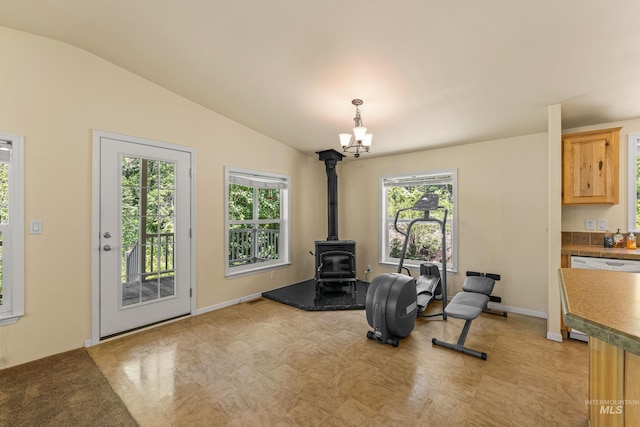 278 Elk Lake Rd, New Meadows, ID 83654 - sitting room with a wood stove, a chandelier, and lofted ceiling