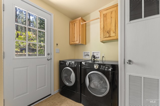 278 Elk Lake Rd, New Meadows, ID 83654 - laundry room with a heating unit, cabinet space, independent washer and dryer, and plenty of natural light
