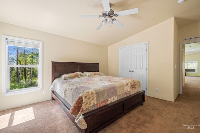 278 Elk Lake Rd, New Meadows, ID 83654 - bedroom with carpet floors, vaulted ceiling, a closet, and a ceiling fan