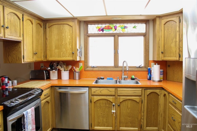 kitchen with sink and appliances with stainless steel finishes