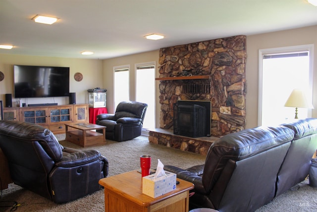 living room with carpet flooring and a fireplace