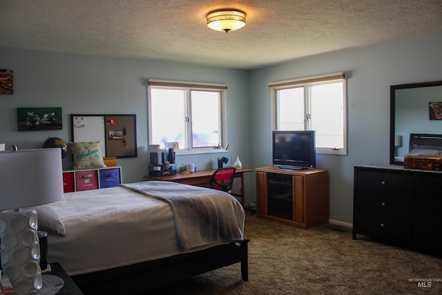 carpeted bedroom with a textured ceiling