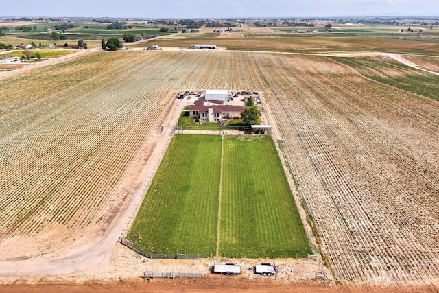 birds eye view of property with a rural view