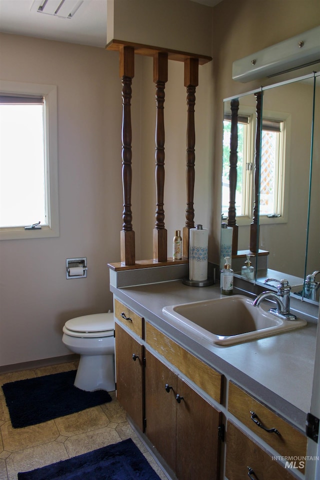 bathroom featuring vanity and toilet