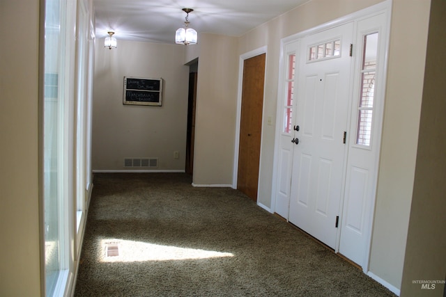 view of carpeted foyer