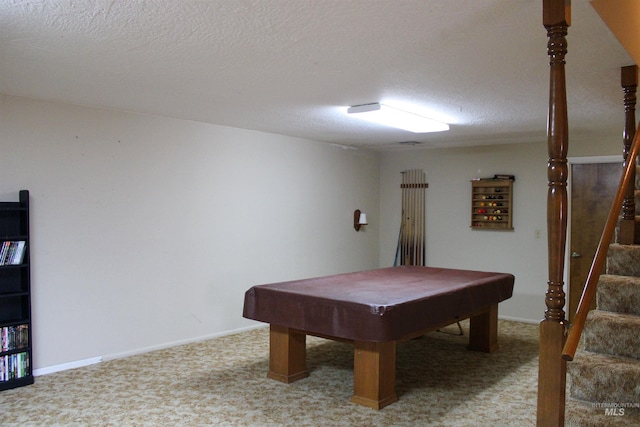 game room with pool table and a textured ceiling