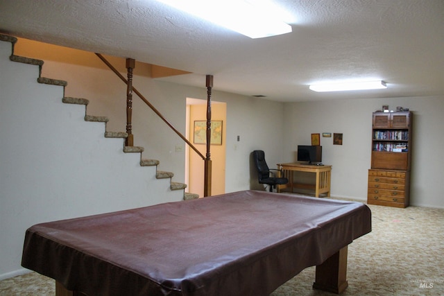 recreation room featuring a textured ceiling, pool table, and carpet floors