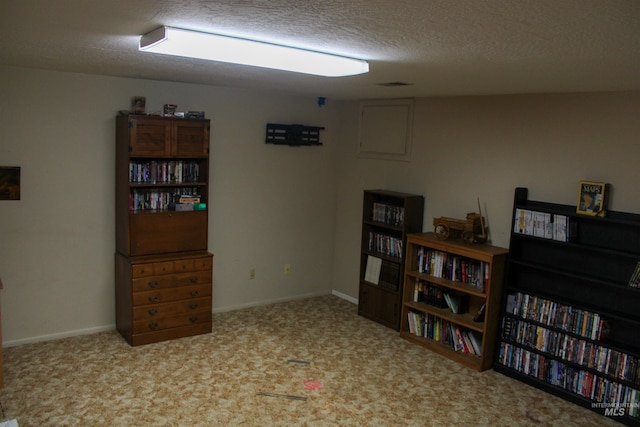 interior space with a textured ceiling