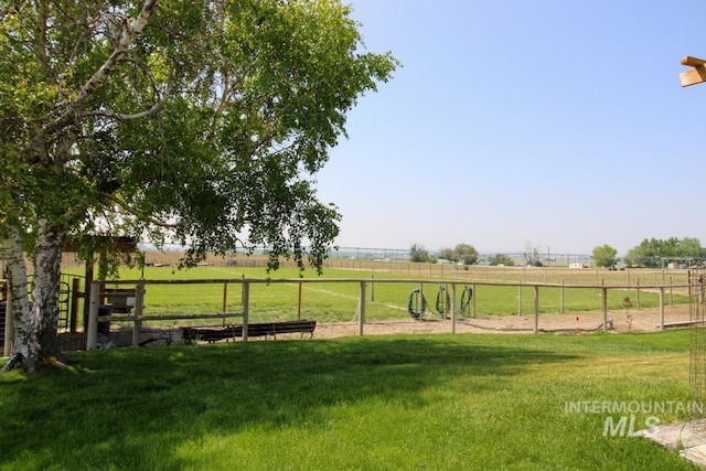 view of yard with a rural view