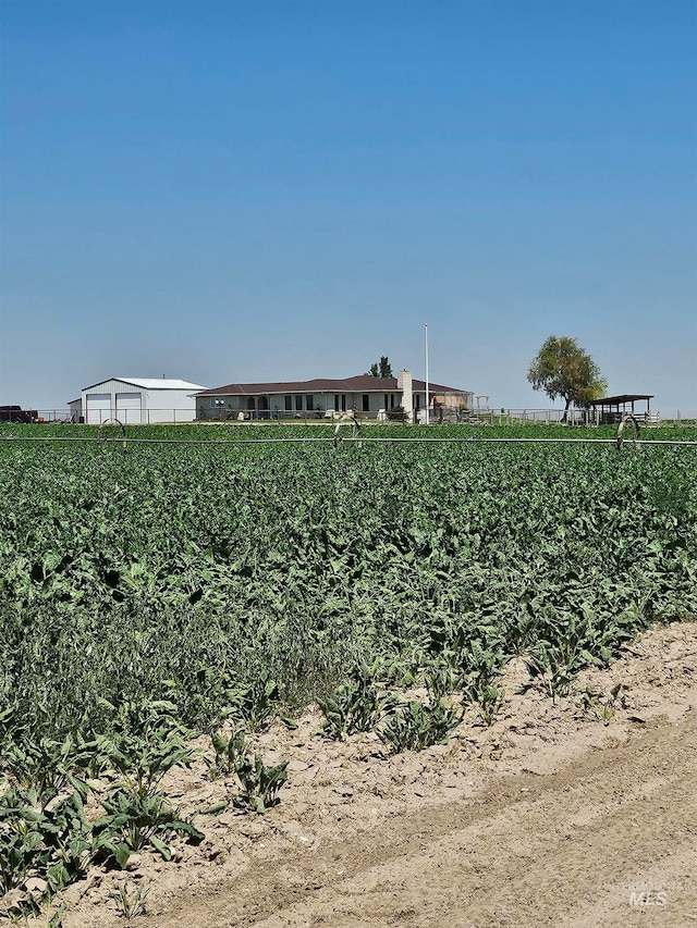 view of yard with a rural view