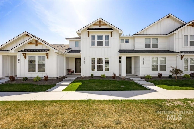 11008 W Portola St, Boise, ID 83709 - view of front of house with board and batten siding, a shingled roof, and a front yard
