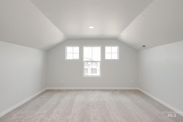 15383 Ivybridge Way, Nampa, ID 83651 - bonus room featuring lofted ceiling, light carpet, visible vents, and baseboards