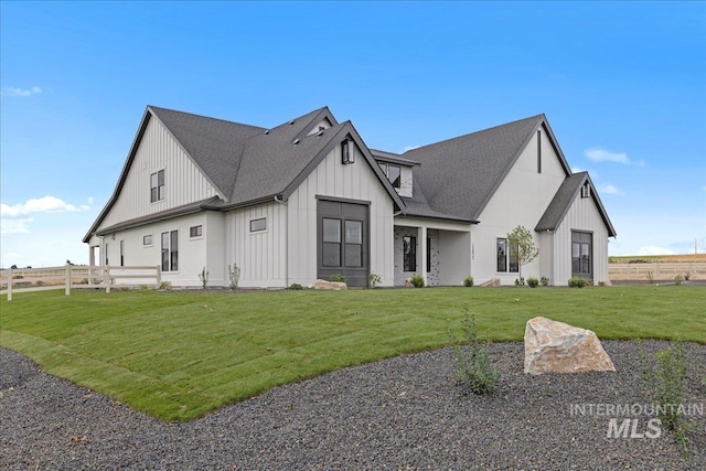 modern inspired farmhouse featuring a front lawn