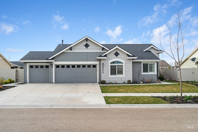 5899 W Cavendale Dr, Eagle, ID 83616 - ranch-style home with a front yard, driveway, fence, and an attached garage