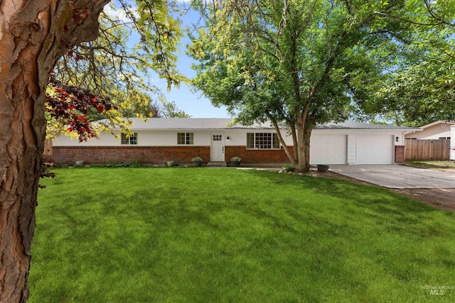ranch-style home with brick siding, driveway, and a garage