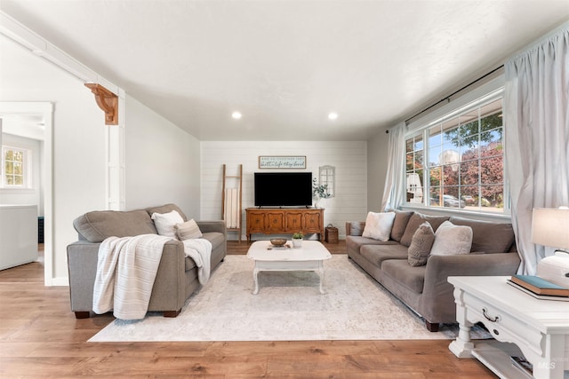 living room with wood finished floors and recessed lighting
