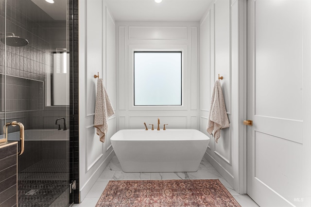 2664 N Yount Way, Eagle, ID 83616 - bathroom with marble finish floors, a freestanding tub, a shower stall, a decorative wall, and recessed lighting