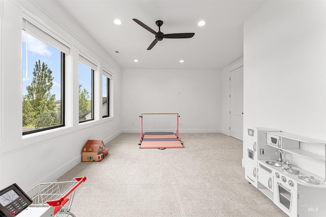 2664 N Yount Way, Eagle, ID 83616 - rec room with a sink, light colored carpet, recessed lighting, a ceiling fan, and baseboards