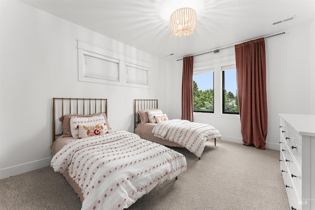 2664 N Yount Way, Eagle, ID 83616 - bedroom with light carpet, baseboards, and a chandelier