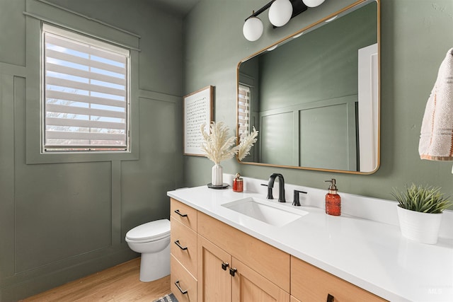 2664 N Yount Way, Eagle, ID 83616 - bathroom featuring wood finished floors, vanity, and toilet