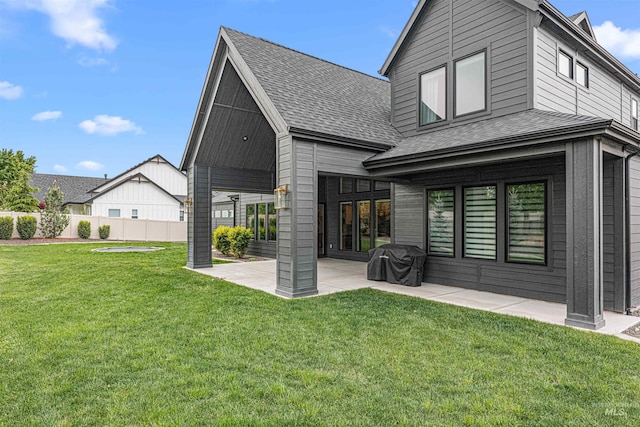 2664 N Yount Way, Eagle, ID 83616 - back of property featuring roof with shingles and a patio
