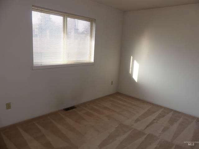 3213 5th St Unit A, Lewiston, ID 83501 - carpeted spare room with visible vents