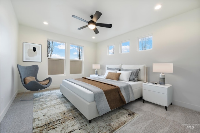 bedroom featuring recessed lighting, baseboards, and light colored carpet