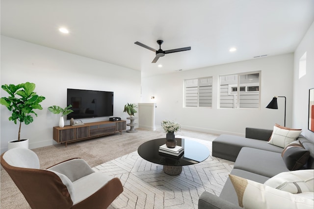 carpeted living room featuring visible vents, recessed lighting, baseboards, and ceiling fan