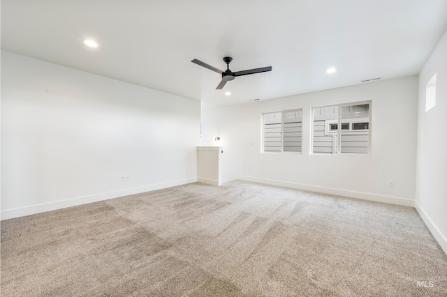 carpeted empty room featuring visible vents, recessed lighting, baseboards, and ceiling fan