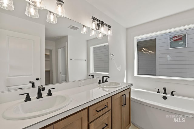 2349 E Valensole St, Meridian, ID 83642 - full bathroom with double vanity, a soaking tub, and a spacious closet