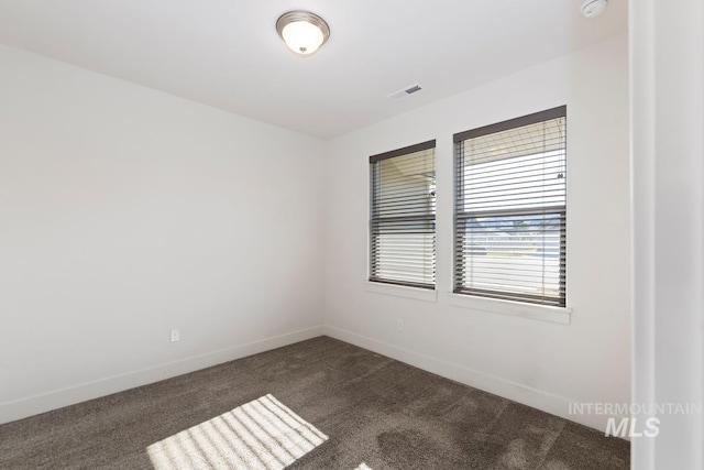 view of carpeted spare room