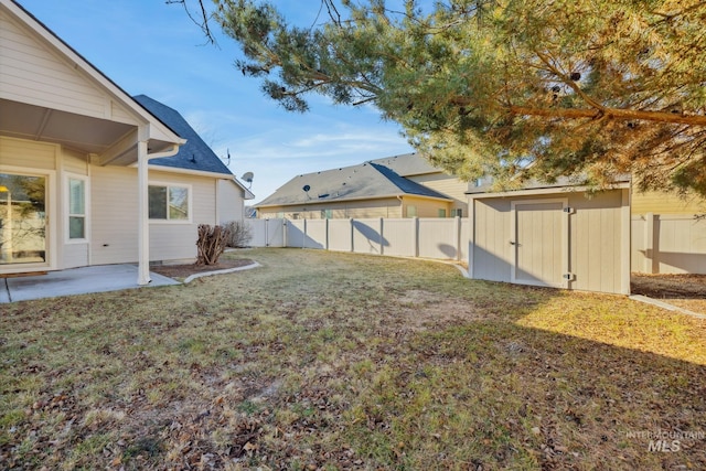 view of yard with a patio and a shed