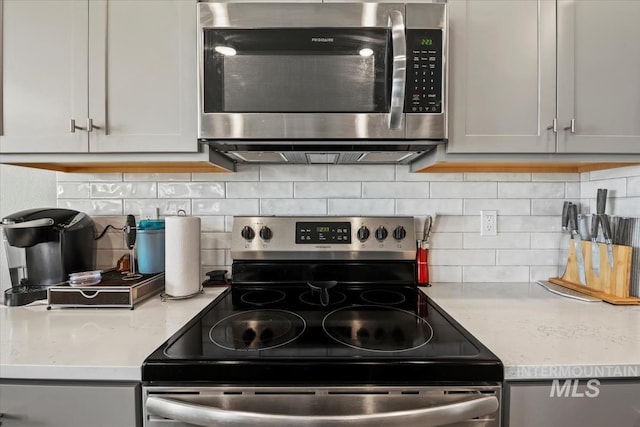 5006 Clearfield St, Caldwell, ID 83605 - kitchen with stainless steel appliances and decorative backsplash