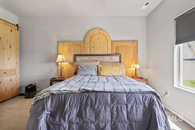 5006 Clearfield St, Caldwell, ID 83605 - bedroom with light carpet, a barn door, and baseboards