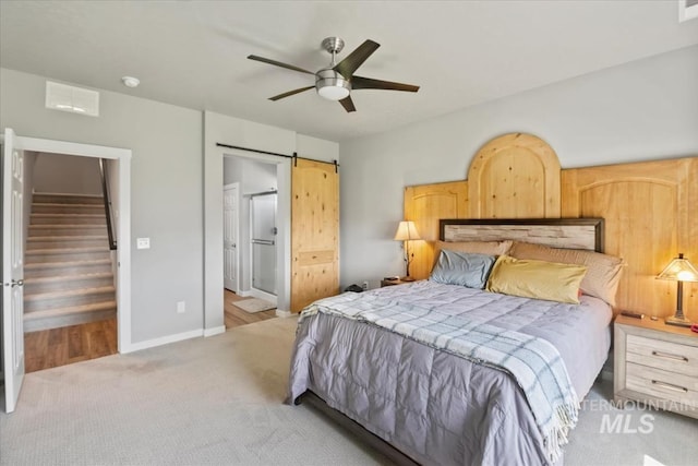 5006 Clearfield St, Caldwell, ID 83605 - bedroom with carpet flooring, a barn door, ensuite bath, baseboards, and ceiling fan