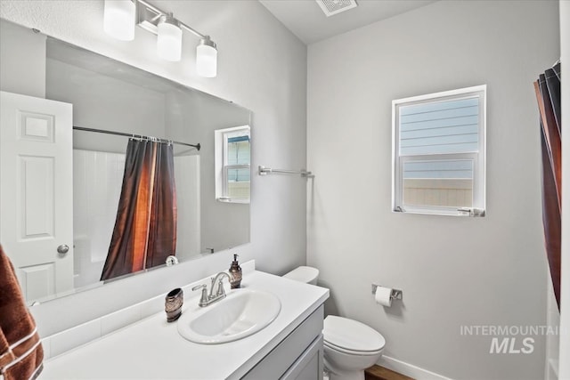 5006 Clearfield St, Caldwell, ID 83605 - bathroom featuring toilet, vanity, and a shower with curtain
