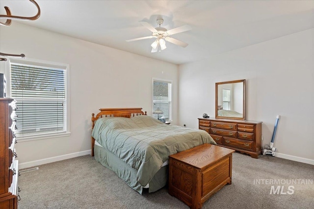 bedroom with light colored carpet and ceiling fan