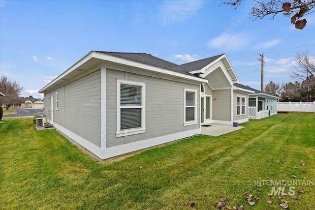 view of property exterior featuring a lawn