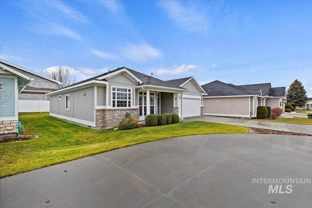 view of front of house featuring a front yard and a garage