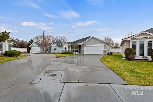 ranch-style home featuring a garage and a front lawn