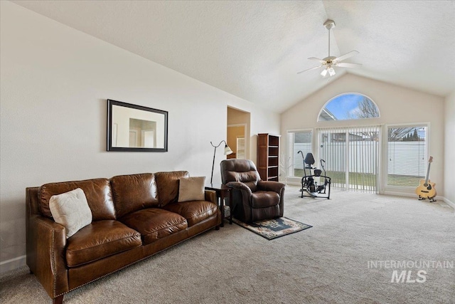 living room featuring ceiling fan, carpet, and lofted ceiling