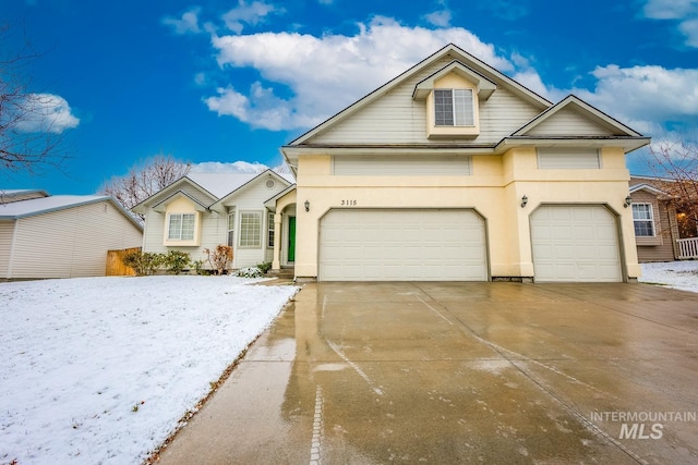 view of front of property with a garage