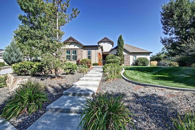 2468 E Lodge Trail Dr, Meridian, ID 83642 - english style home featuring a front yard and stone siding