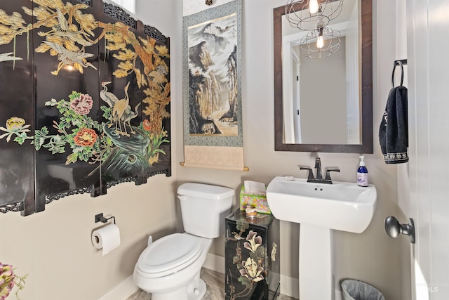 2468 E Lodge Trail Dr, Meridian, ID 83642 - half bathroom featuring baseboards and toilet