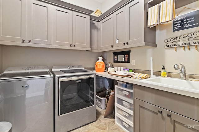 2468 E Lodge Trail Dr, Meridian, ID 83642 - laundry area featuring a sink, washing machine and clothes dryer, and cabinet space