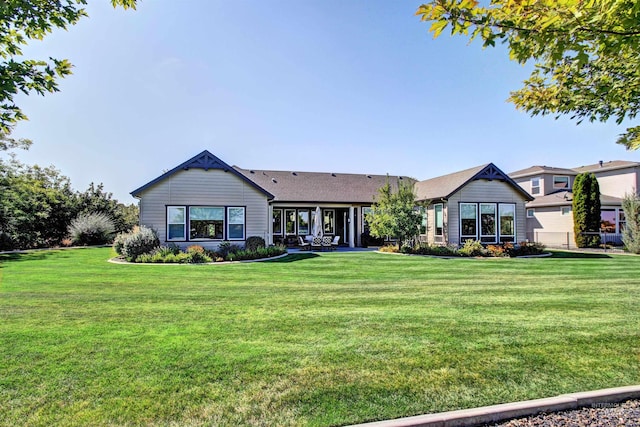2468 E Lodge Trail Dr, Meridian, ID 83642 - rear view of property featuring a yard and a patio